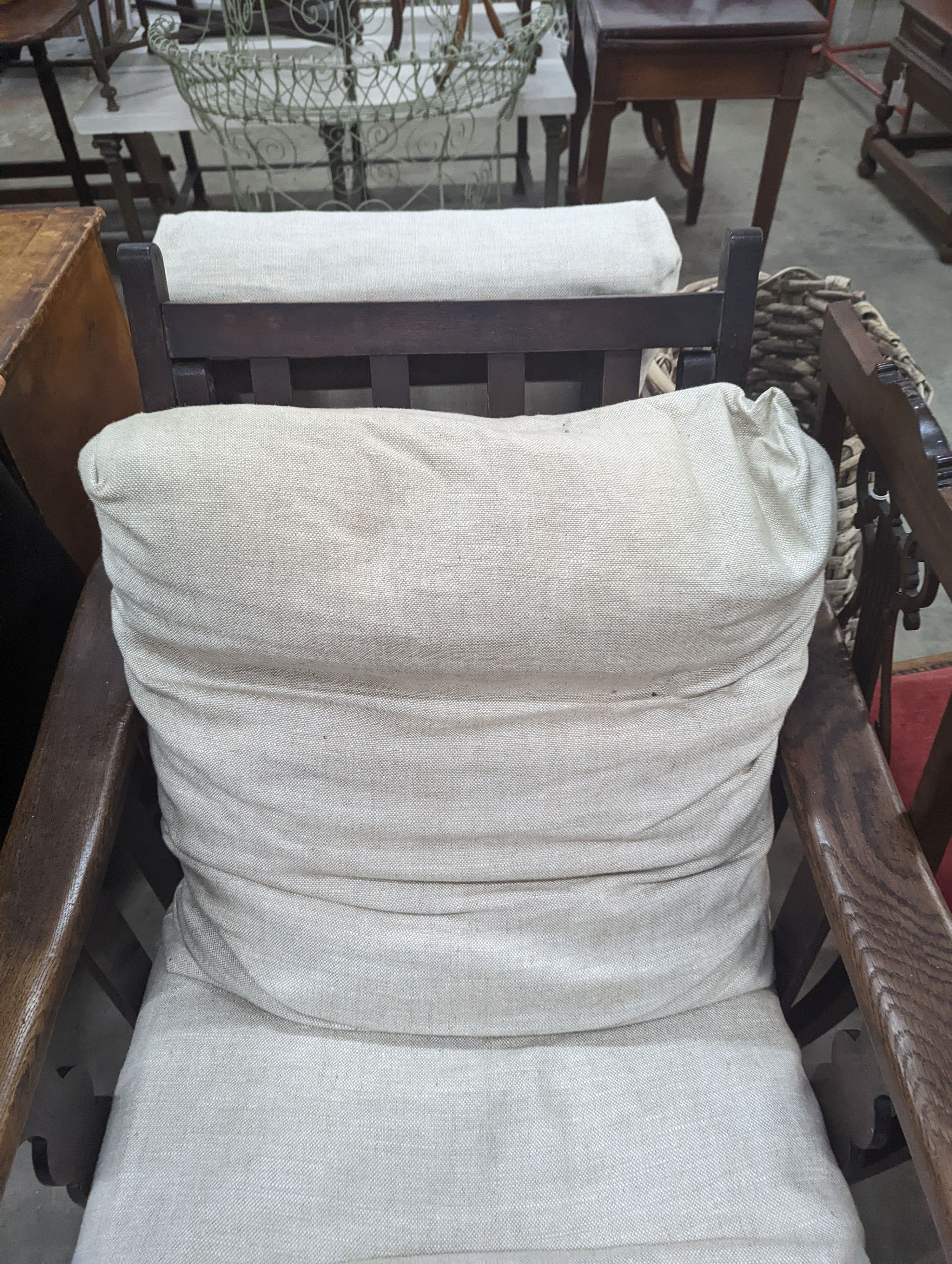 Two early 20th century oak reclining armchairs, larger width 73cm, depth 86cm, height 93cm